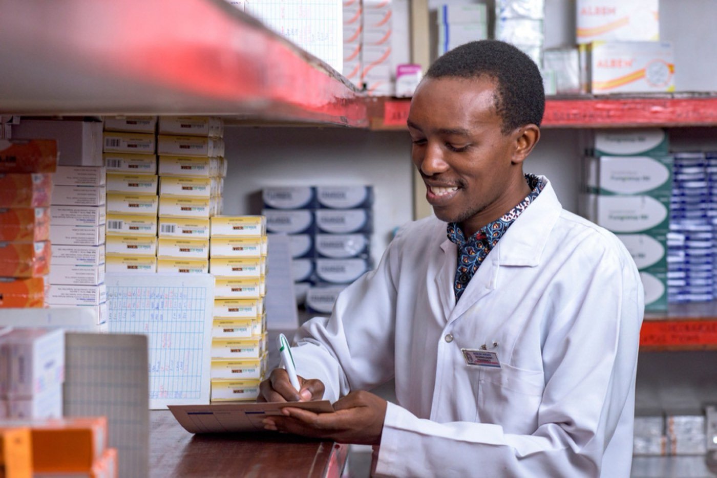 A pharmacist checking medicines in a church hospital pharmacy