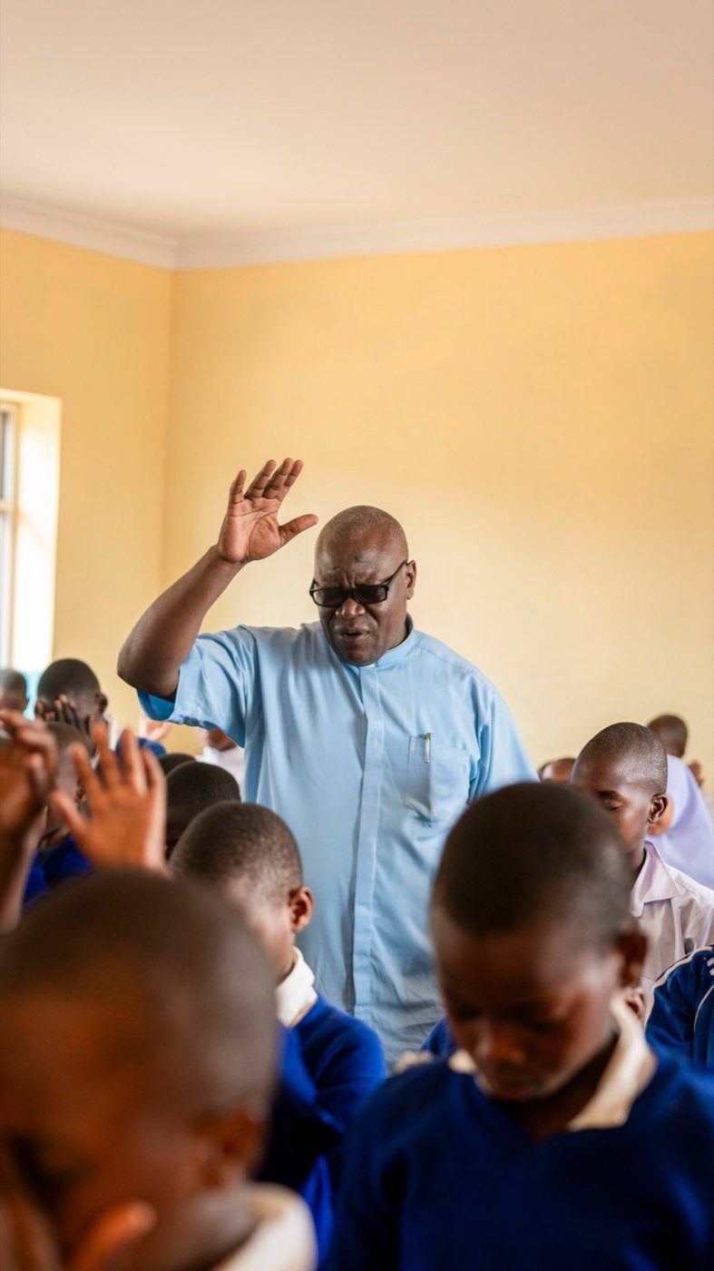 A teacher engaging pupils in a classroom